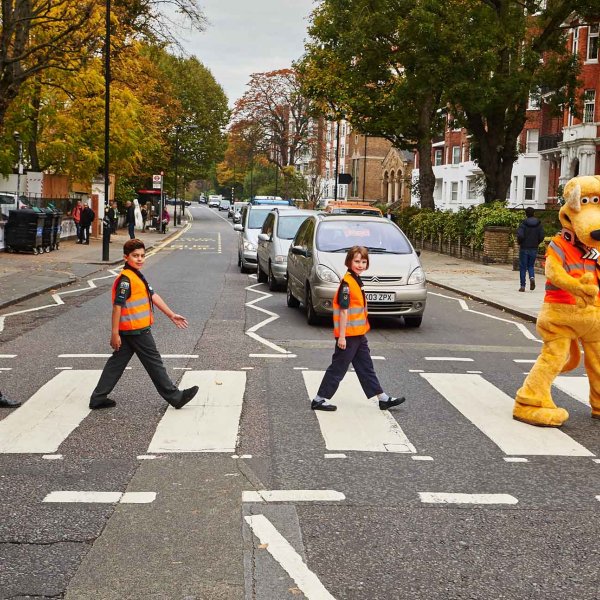 RAC20102015-11 large  20/10/2015  London, UK. Roads minister Andrew Jones, cut scouts Ryan Shahrokh 9, and Jemima Vitou, 8 and RAC mascot Horace Champion the dog recreate the famous Beatles album cover at the zebra crossing on Abbey Road at the launch of the new Cub Scout road safety badge sponsored by the RAC. Photo: Professional Images/@ProfImages